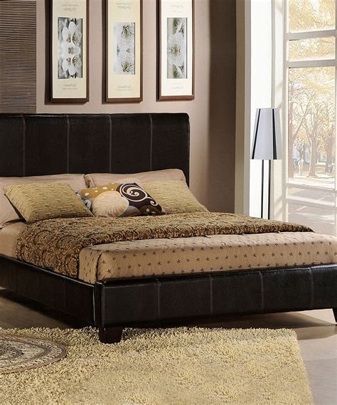 An upholstered bed with an upholstered headboard steals the show in this elegant space by jodie rosen design. Dark Brown Upholstered Queen Bed | zulily | Upholstered ...