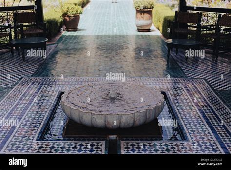 Old Water Well Fountain In Arabic Stile On A Tiled Floor In Marrakesh