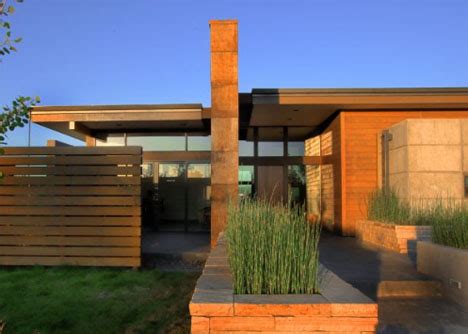 Climbing vines, a large shade tree or a meandering path to your front door may all help bring out your home's best qualities. Rustic Modern: Earth, Wood & Steel High-Desert Home ...