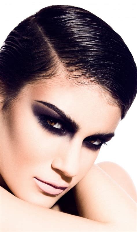 To create a strong base for your black eyeshadow, grab a black gel eyeliner and begin outlining the shape of your look. Black Smokey Eye Makeup Ideas - fashionsy.com
