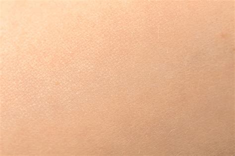 긁힌 자국이 있는 인간의 피부 질감 세부 건강한 분홍색 피부 배경 사진 프리미엄 사진