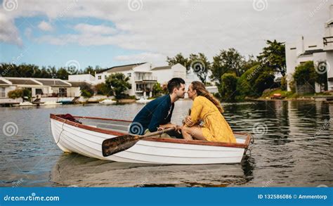 Romantic Couple Sitting In A Boat And Kissing Stock Photo Image Of