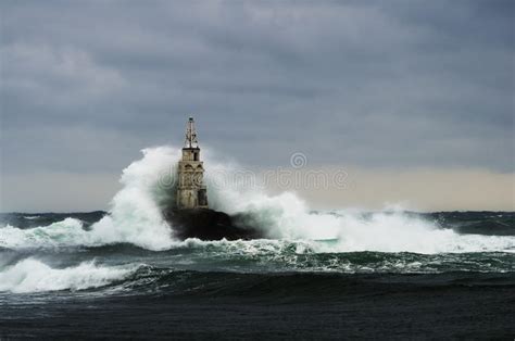Old Lighthouse In The Sea In Stormy Day Stock Photo Image Of Black