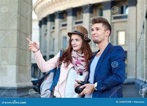 Happy Love Couple Of Tourists Taking Photo On Excursion Or City Tour