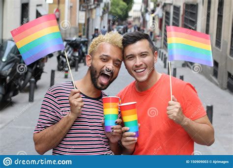Ethnic Gay Couple Celebrating Diversity Outdoors Stock