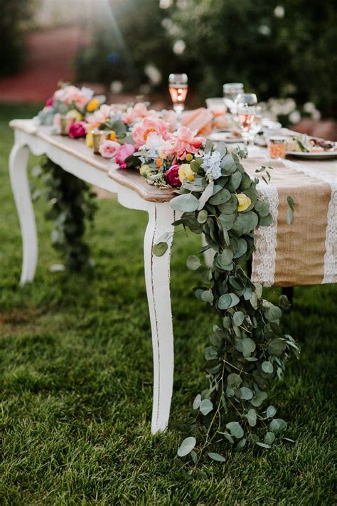 Garland With Flowers On The Sweetheart Table Lets Frolic Together