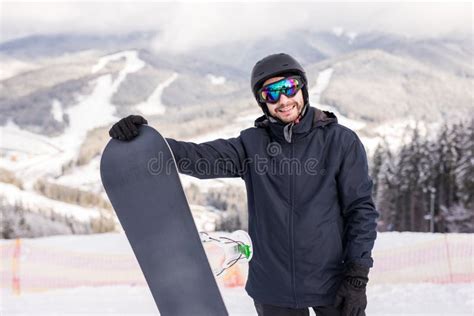 Snowboarder Hold Snowboard On Top Of Hill Close Up Portrait Snow