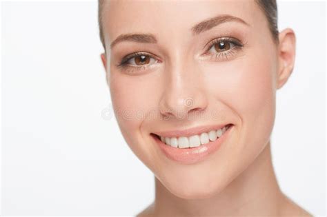 Perfect Smile And Flawless Skin Portrait Of A Beautiful Smiling Woman Isolated On White Stock