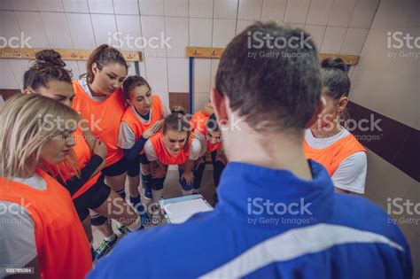 Coach Talking To Players In Locker Room Stock Photo Download Image