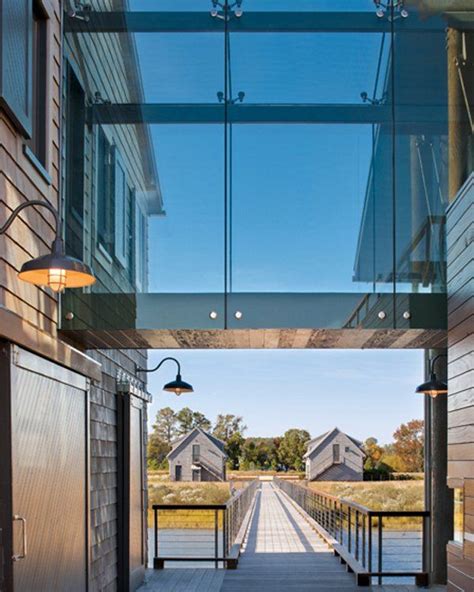 A Glass Bridge Connects Public And Private Spaces Framing Views To