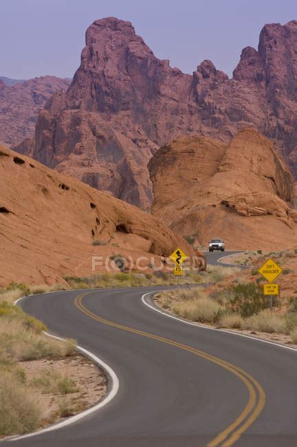 Car Riding On Highway Through Valley Of Fire State Park Nevada Usa