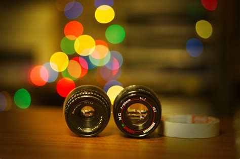 Selective Focus Photography Of Two Black Zoom Lens Covers On Brown