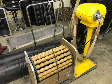 4 Pieces Of Vintage Exercise Equipment And 2 Full Size Punching Bags