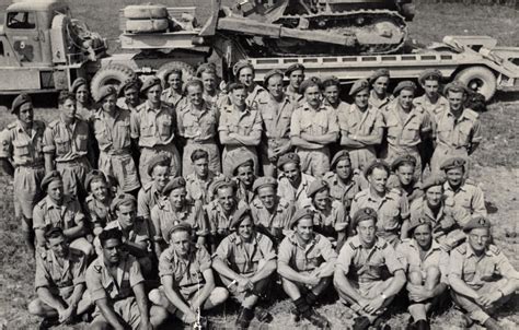 Military Service World War Ii Engineers Group With Bulldozer On