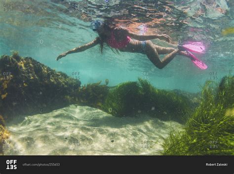 Woman Snorkeling Near Divers Cove In Laguna Beach California Stock