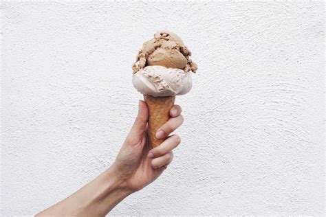 Once your cream is holding a shape, pour in the cold condensed milk and continue whipping until the mix holds stiff peaks. 2016's Song of the Summer Is an Ice Cream Cone Held Up In ...