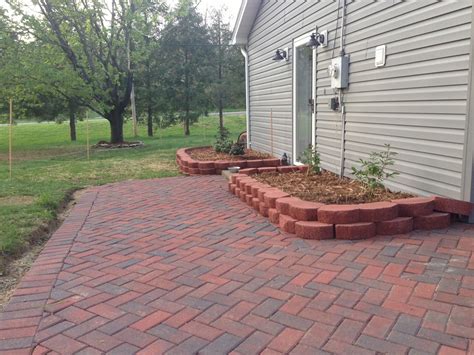 Start by digging out the area where you'd like to place your stone paver patio. Newlywed Nesters: DIY Paver Patio