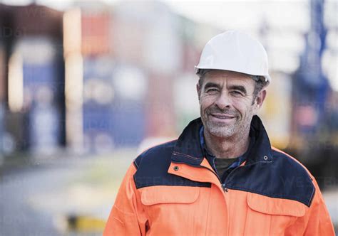 Smiling Male Blue Collar Worker At Industry Stock Photo