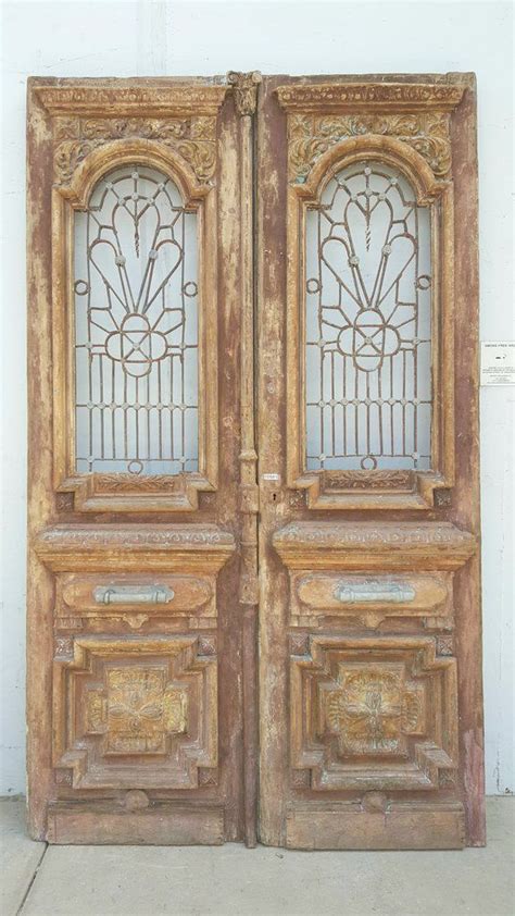 Pair Of Wood Carved Door With Iron Inserts Antiquities Warehouse