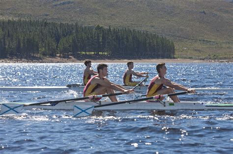 Two Double Scull Rowing Boats In Water Stock Photo