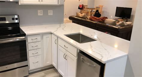 Pale, neutral kitchen with a cambria quartz countertop. Calacatta Quartz Countertop - Yelp