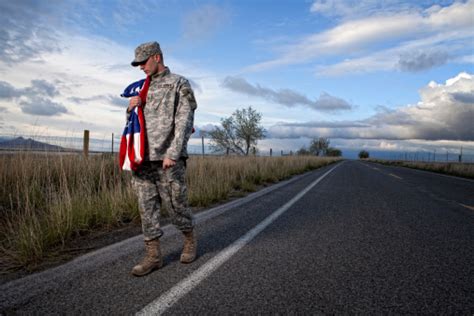 Lonely Military Soldier Walking Down A Road Stock Photo Download