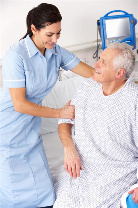 Nurse Helping Patient Sit Up In Bed Stock Photo Image Of Adult Color