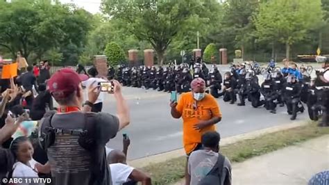Tense Protest Turns Emotional As 60 North Carolina Police Kneel Before
