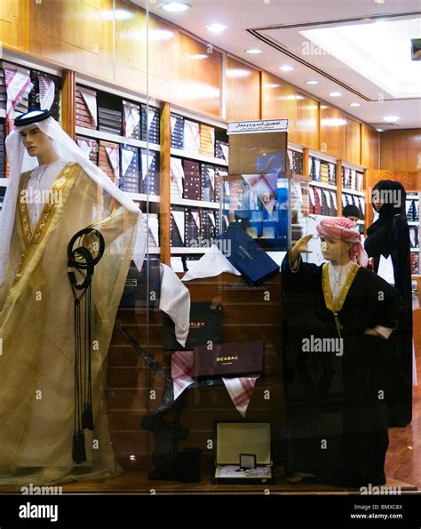 Woman Shopper In A Menswear Store Selling Gulf Arab National Dress At