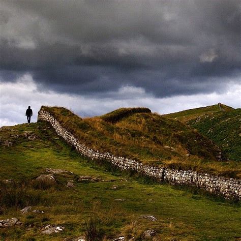 A Hiker Walks Along Hadrians Wall In England The Walls Construction