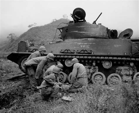 Burnt Out M4a3e8 Sherman Receiving The Attention Of A Demolition Squad