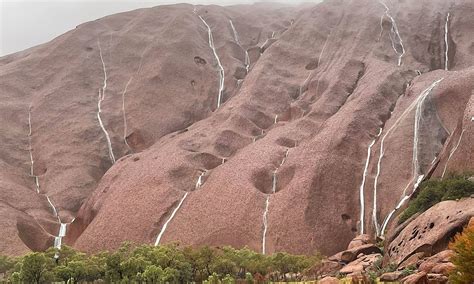 Rare Waterfalls Form On Iconic Uluru After Heavy Rain In Australian