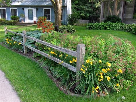 Wrought iron gates, wood, security, split rail, vinyl, dog, electric fence ideas. Split-rail fence, stella d'oro daylilies and spirea in the ...