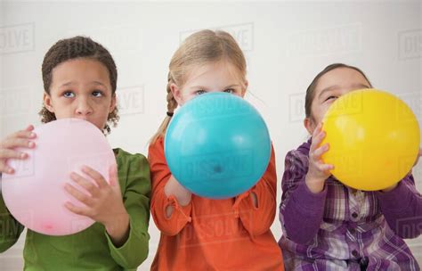 Girls Blowing Balloons Telegraph