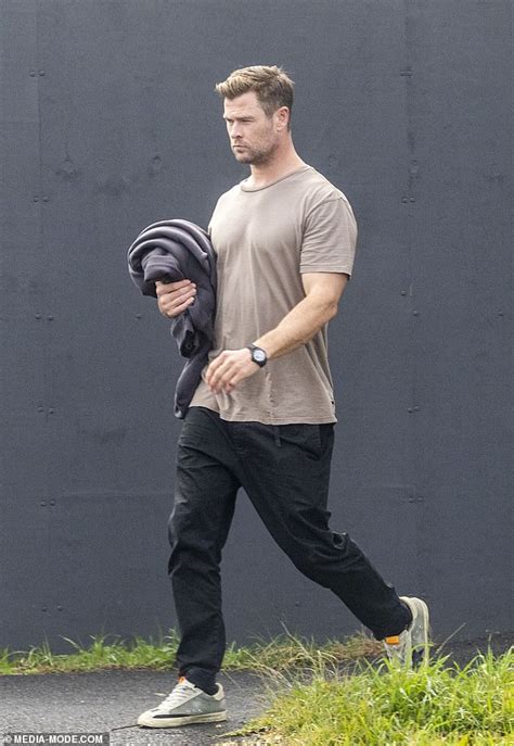 Chris Hemsworth Covers His Bulging Biceps In A Loose Fitting T Shirt As