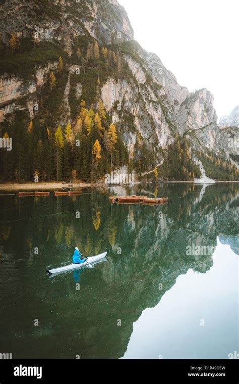 Beautiful View Of Famous Lago Di Braies With Young Man In Kayak At