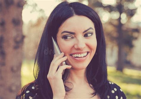 Cheerful Woman Speaking On A Phone Outdoors Stock Image Image Of