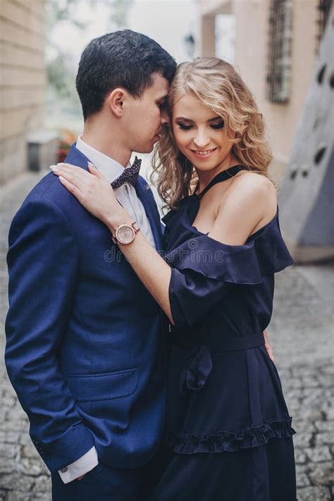 Stylish Couple Embracing In Rainy European City Street Tender Romantic Moment Fashionable Man