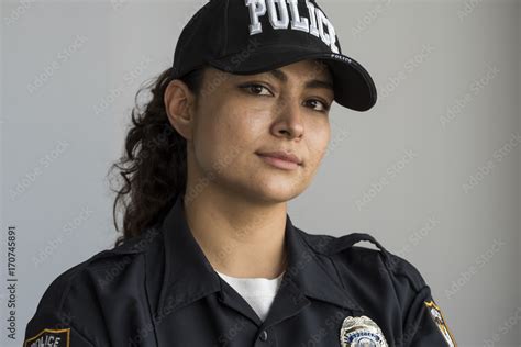 Portrait Of A Hispanic Female Police Officer Stock Photo Adobe Stock
