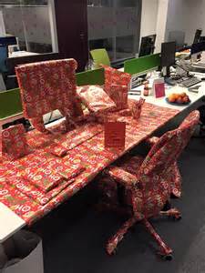 Give managers a budget of $100 and challenge teams to a workspace decoration contest; 40 Office Christmas Decorating Ideas - All About Christmas