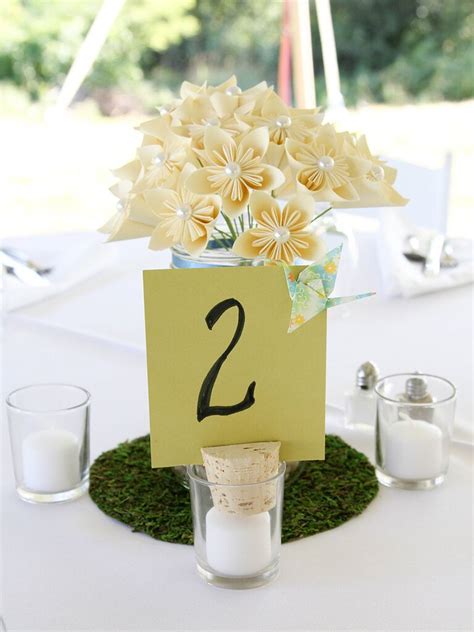 Ling's moment pew flowers with tails, $60. 15 Ways to Use Paper Flowers at Your Wedding