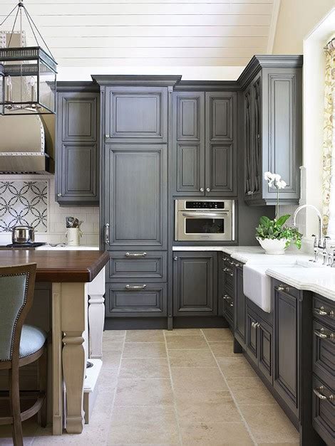 Design by eden la interiors photo by kim pritchard photography inspiration for a large french country limestone floor and beige floor kitchen remodel in los angeles with an undermount sink, dark wood cabinets, stainless steel appliances and. Uptown Country: Gray Kitchen Cabinets?