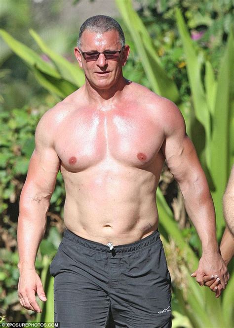 Chef Robert Irvine Displays Ripped Chest On Romantic Stroll With