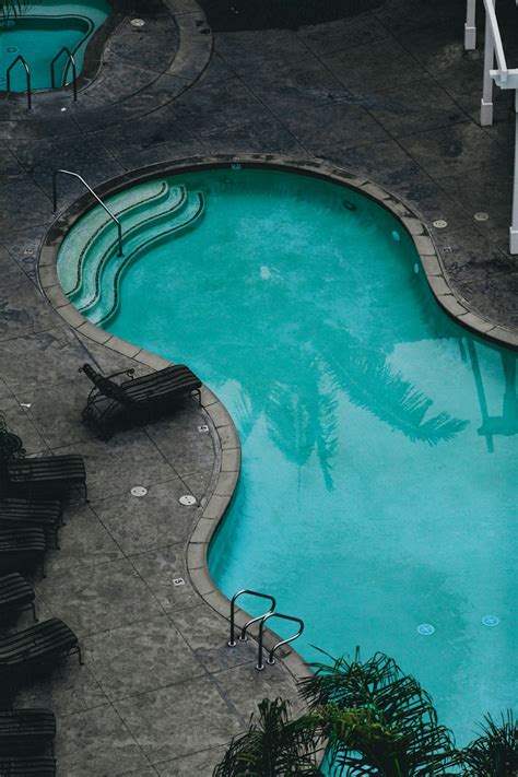 Swimming Pool During Daytime In Aerial View Photography Photo Free