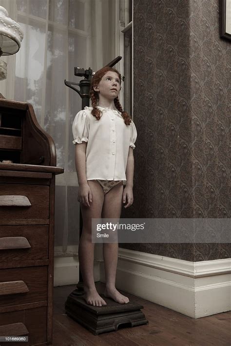 Young Girl Measuring Her Height Photo Getty Images