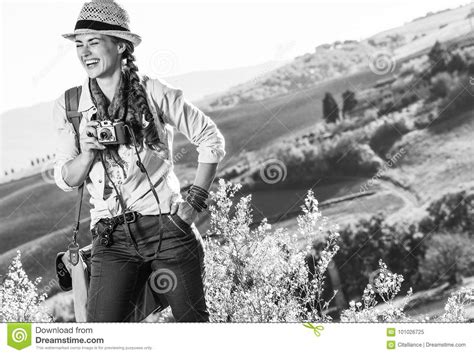 Smiling Woman Hiker On Tuscany Hike With Vintage Photo Camera Stock