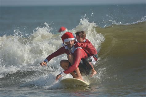 surfing santas extravaganza cocoa beach florida christmas eve surfing december 24th 2017 by raw