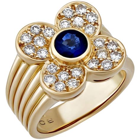 Van Cleef And Arpels 18k Yellow Gold Diamond And Sapphire Floral Ring