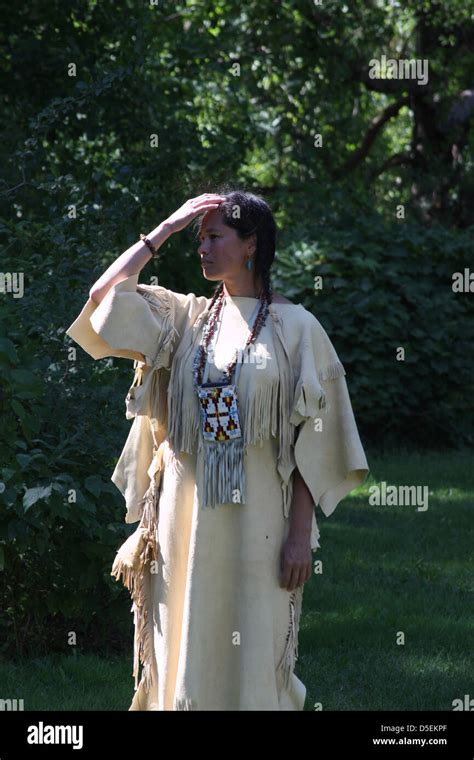 A Native American Indian Lakota Sioux Woman Standing In A Leather Dress