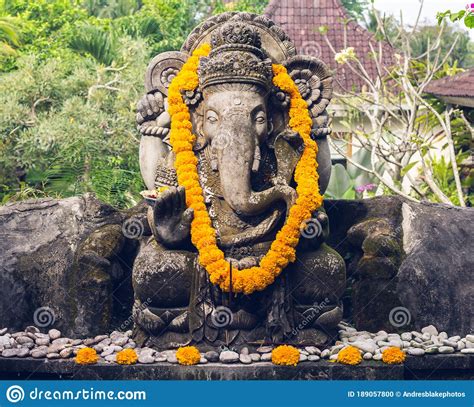 Ganesha Statue With Offerings On The Island Of Bali In Indonesia Stock